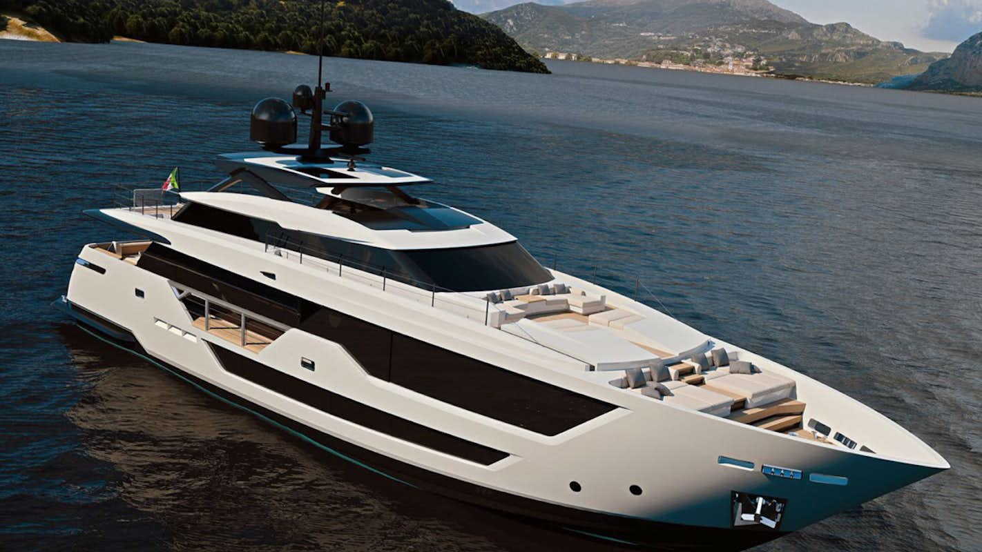 A sleek white Custom Line 106 yacht anchored near a lush coastline under a clear sky.