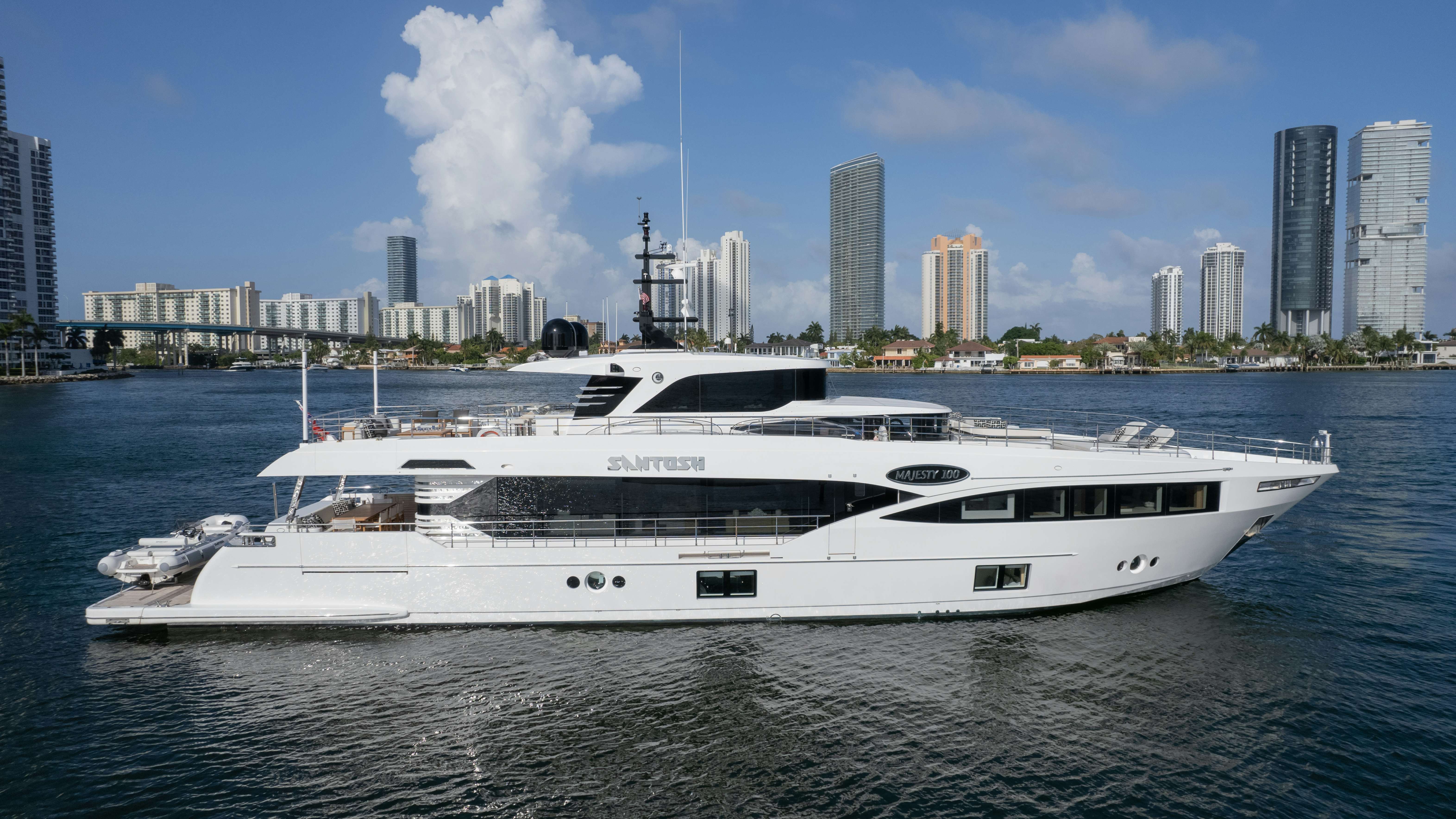 a white yacht in the water aboard SANTOSH Yacht for Sale