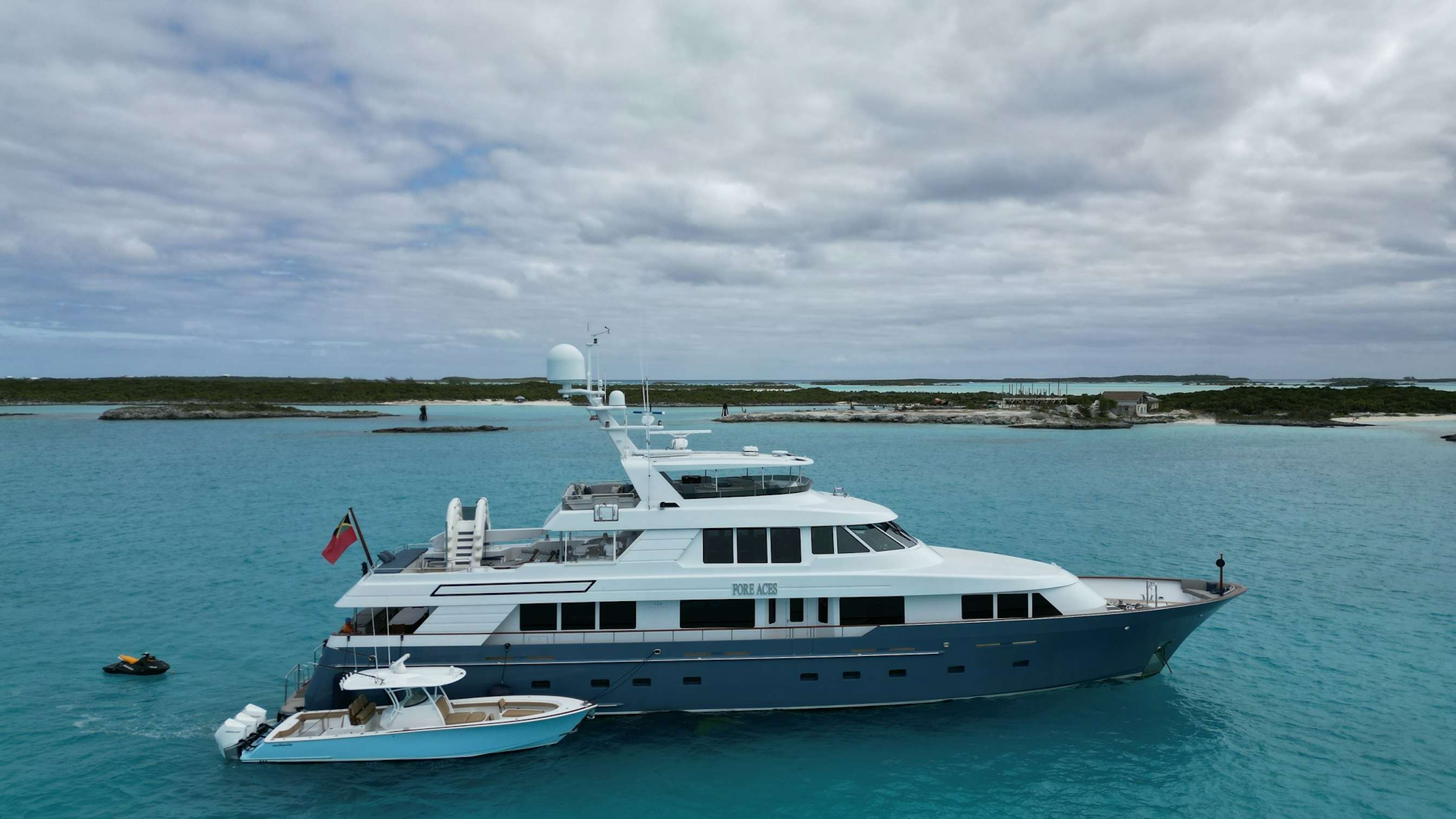 a white boat in the water aboard FORE ACES Yacht for Charter