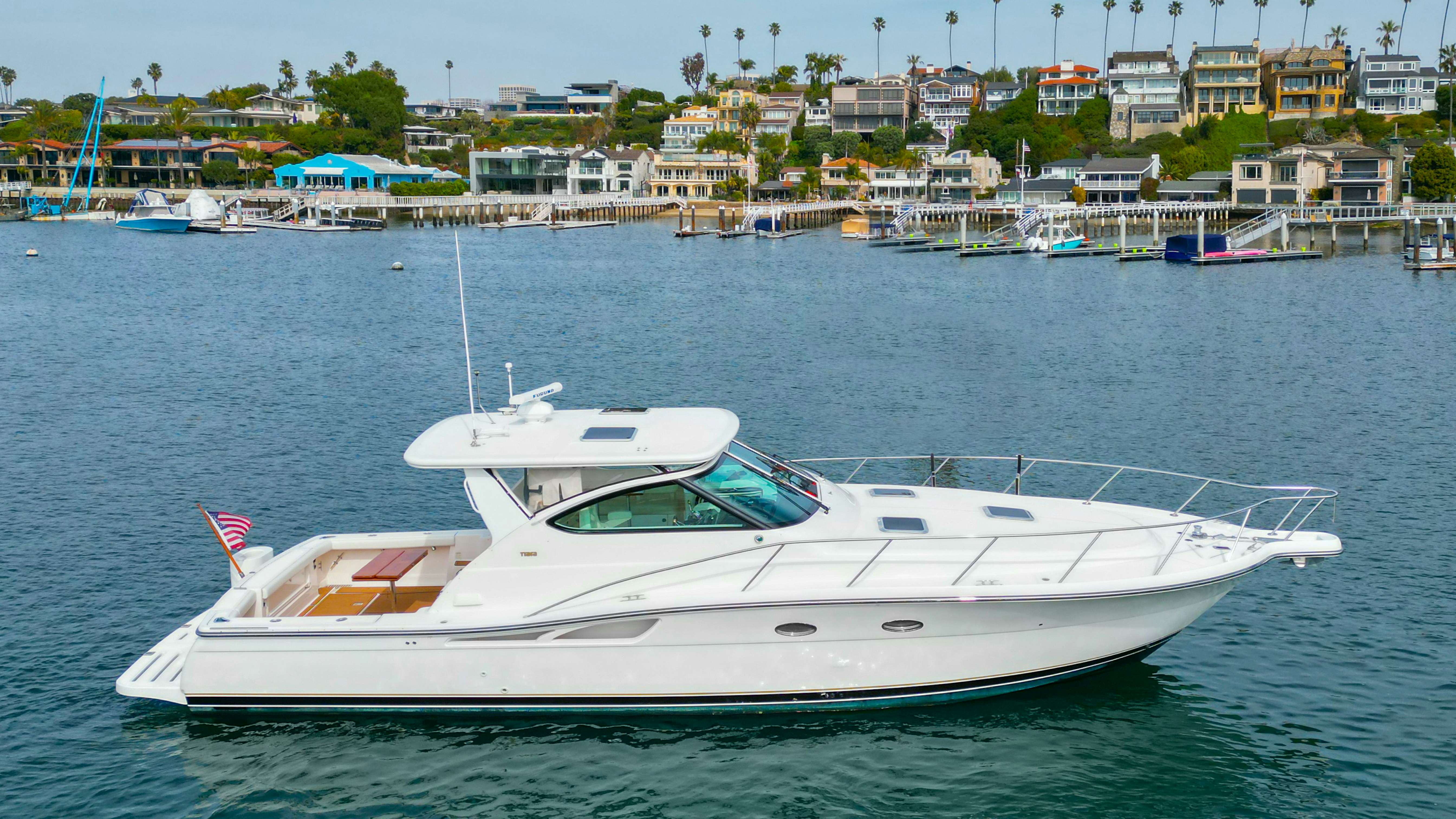 a white boat in the water aboard TROUBLE Yacht for Sale