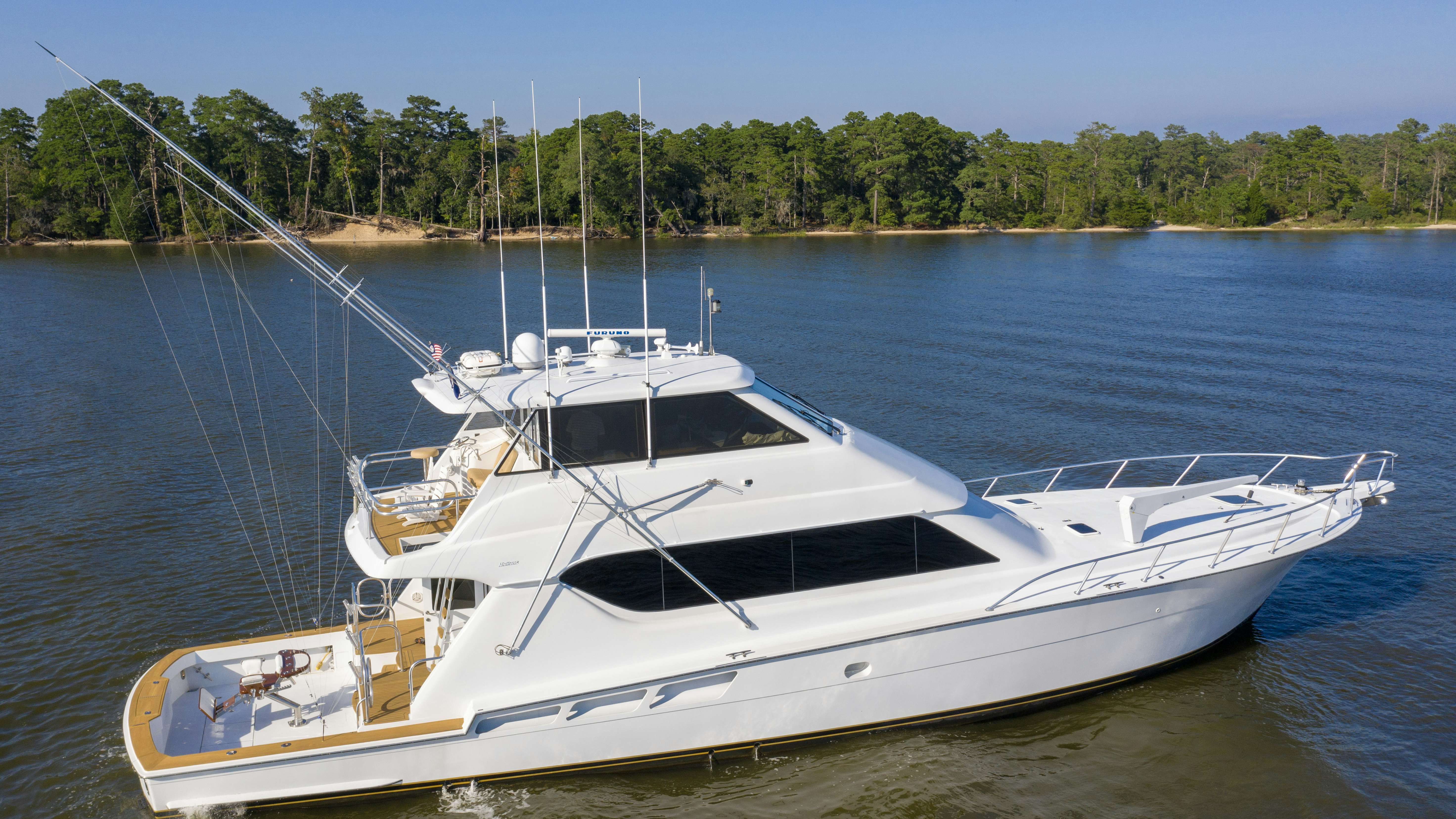 a white yacht on the water aboard SONORA Yacht for Sale