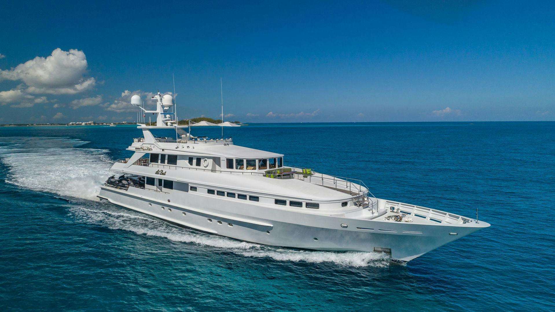 a large white boat in the water aboard AT LAST Yacht for Sale