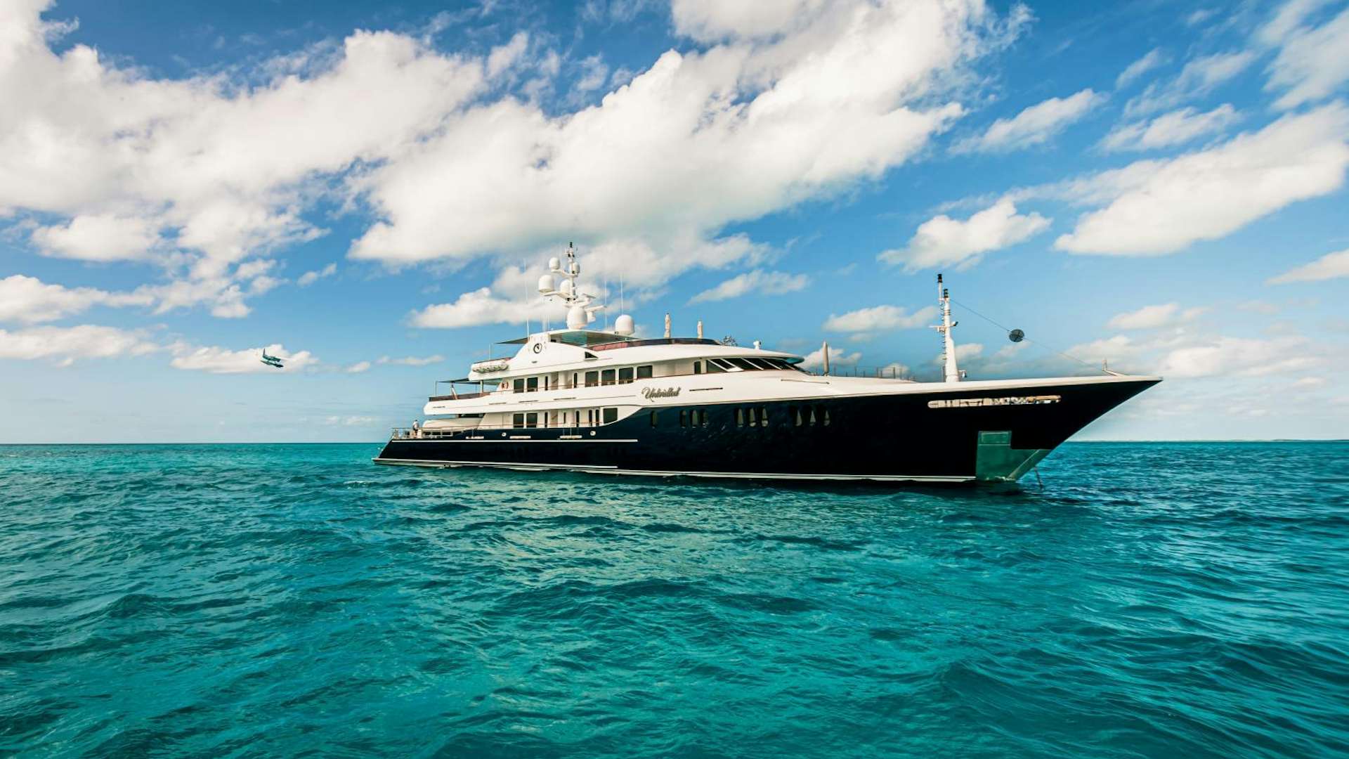 a large ship in the water aboard UNBRIDLED Yacht for Sale