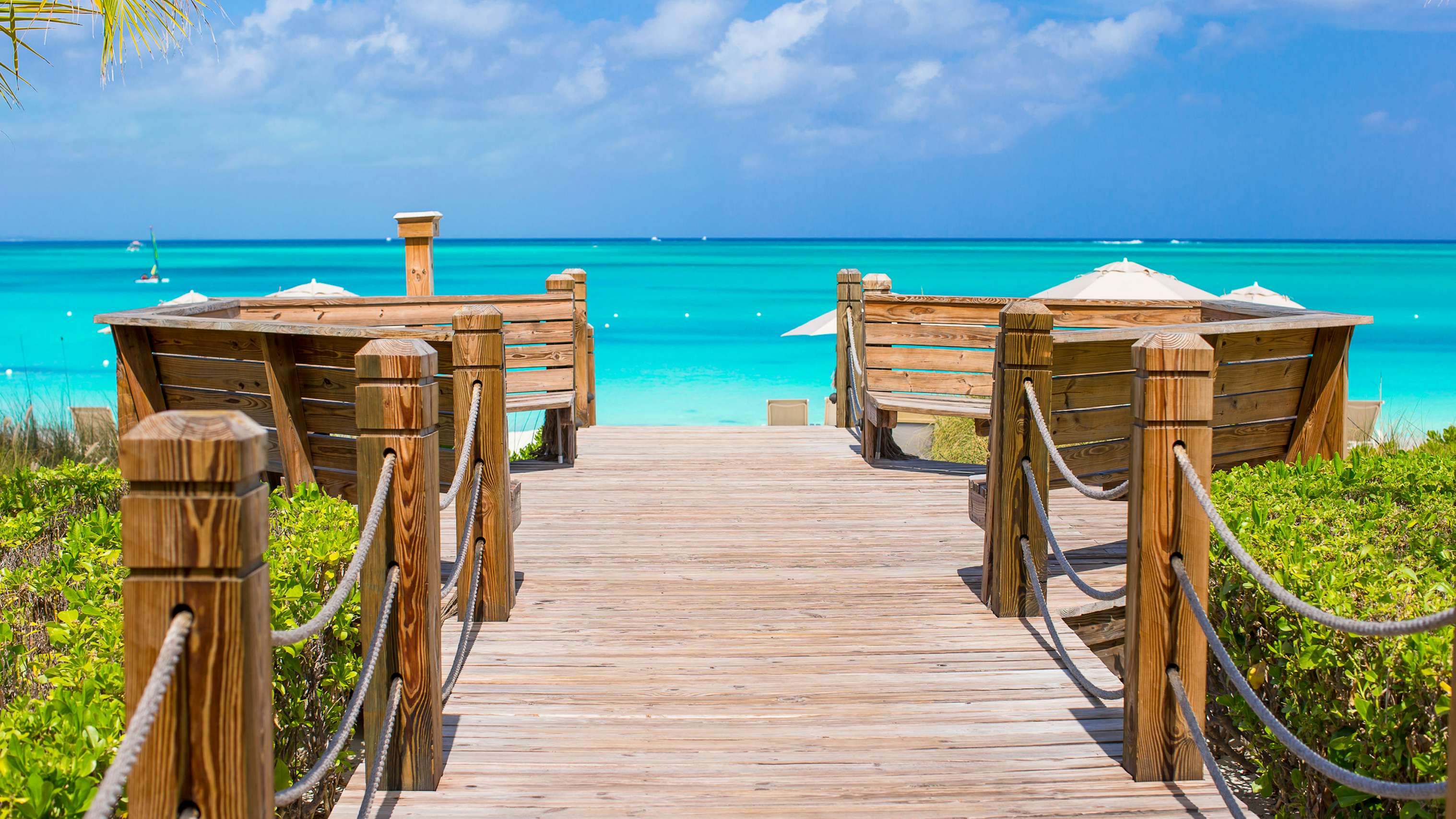 Turks & Caicos Yacht Charter - Turks and caicos beach wooden bridge to the ocean