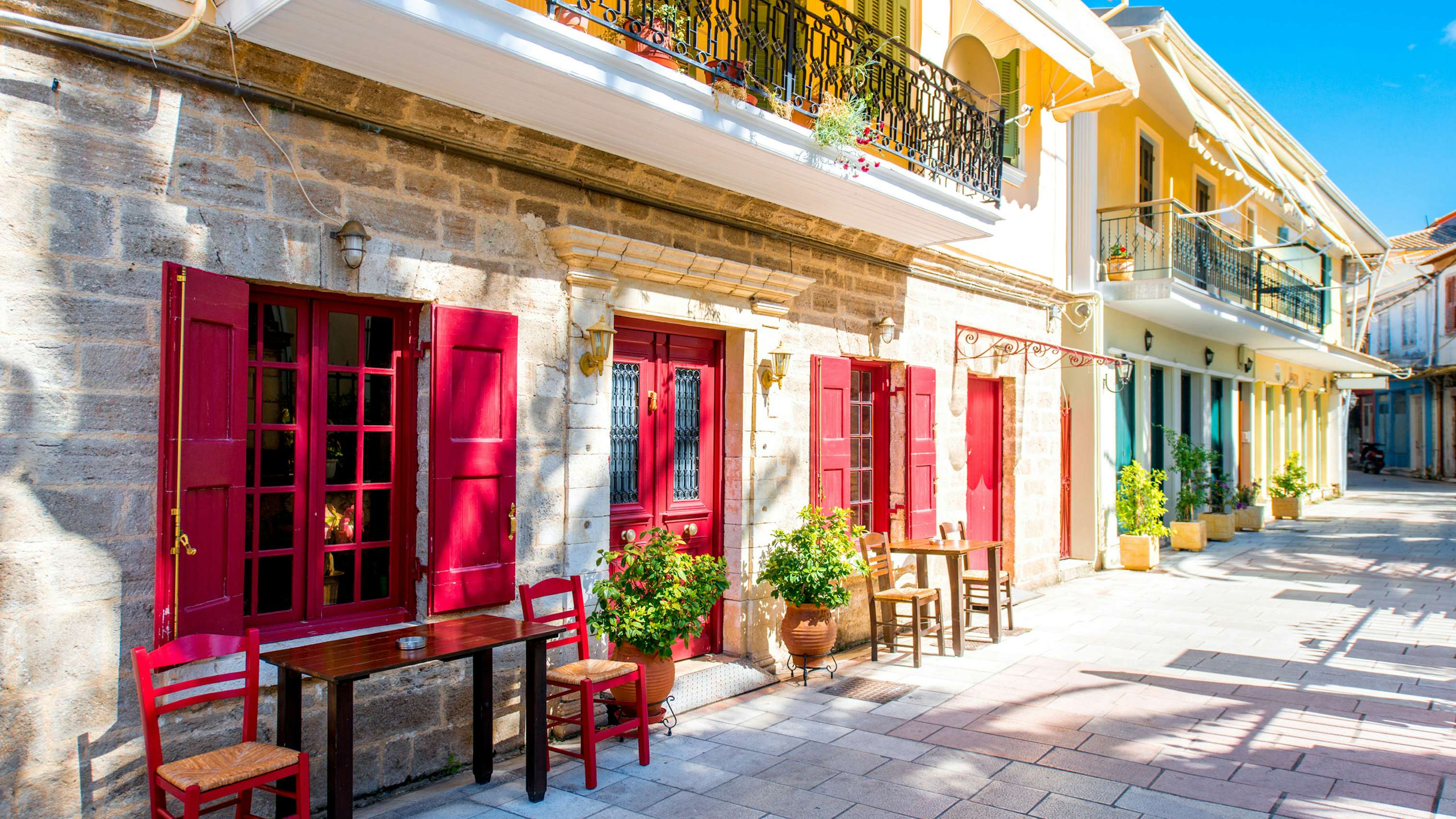 Colorful facades of Levkas town, reflecting the vibrant Greek culture, perfect for a leisurely yacht charter stop.