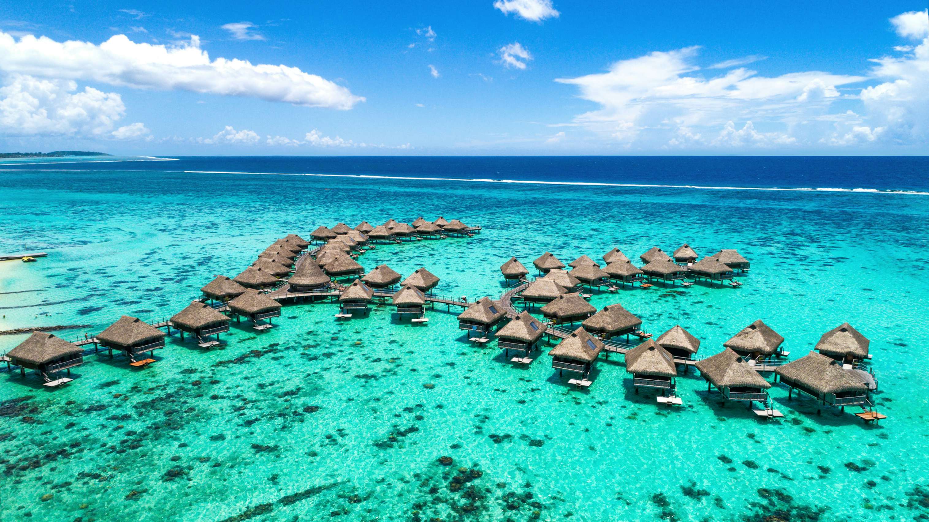 South Pacific Yacht Charter - Huts in the beautiful waters of Moorea