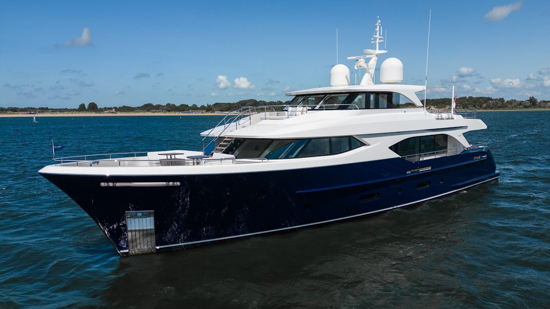 Moonen superyacht at sea with land on the horizon